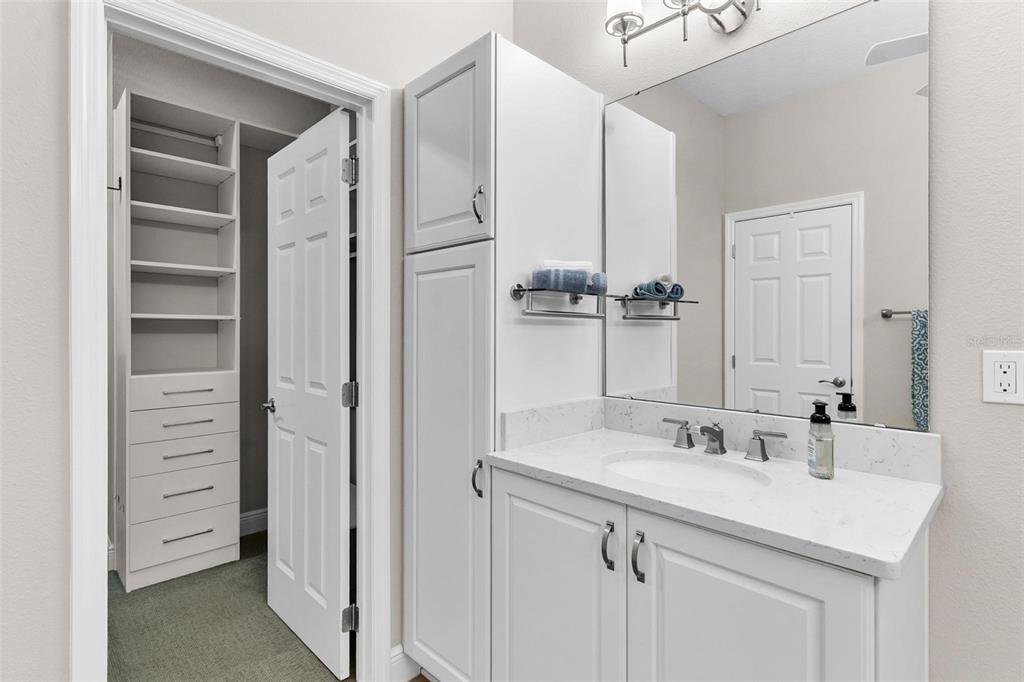 224 Silver Maple Road Groveland, FL 34736 - Photo 32 of 54 a bathroom with a sink and a mirror