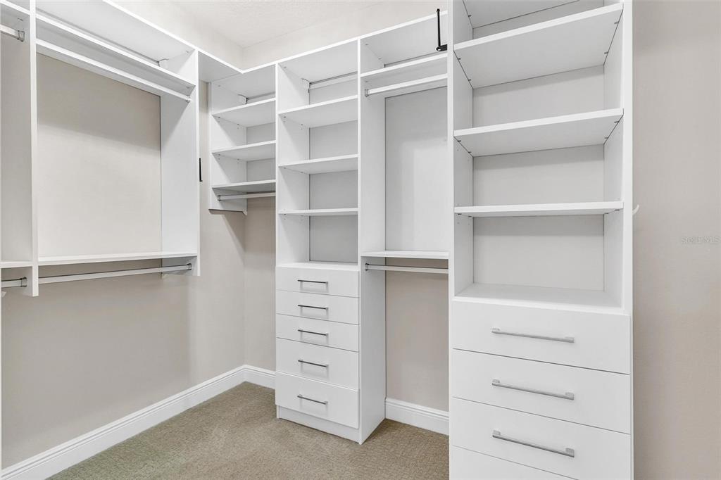 224 Silver Maple Road Groveland, FL 34736 - Photo 33 of 54 a view of walk in closet with empty racks