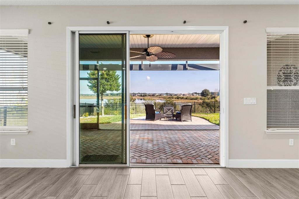 224 Silver Maple Road Groveland, FL 34736 - Photo 38 of 54 an outdoor view dining room with a wooden floor