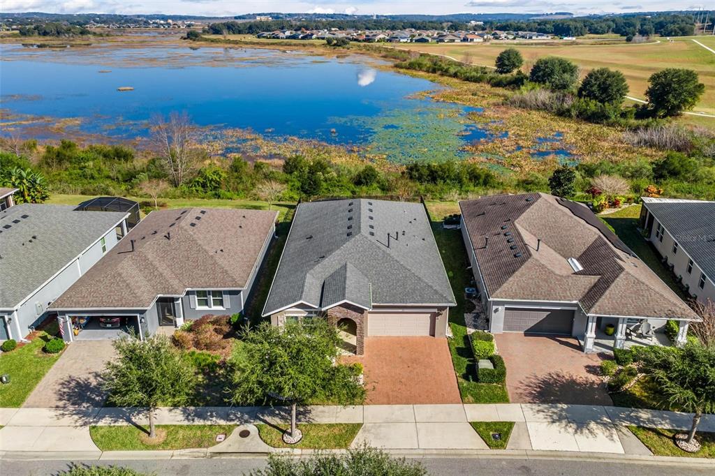 224 Silver Maple Road Groveland, FL 34736 - Photo 4 of 54 an aerial view of residential houses with outdoor space