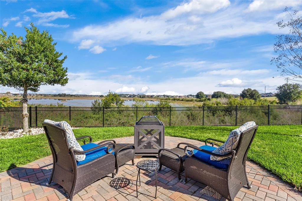 224 Silver Maple Road Groveland, FL 34736 - Photo 44 of 54 a view of a chairs and table in the garden