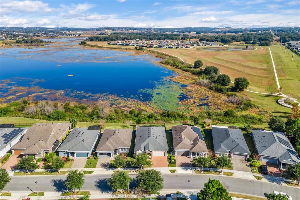 224 Silver Maple Road Groveland, FL 34736 - Photo 49 of 54 an aerial view of ocean and residential houses with outdoor space