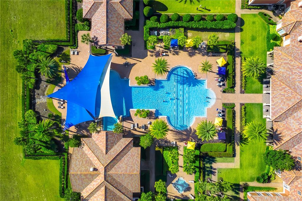 224 Silver Maple Road Groveland, FL 34736 - Photo 53 of 54 a view of a house with a yard and garden