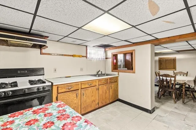 a kitchen with a stove and a refrigerator