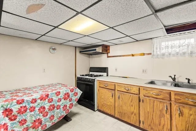 a bedroom with a bed and a sink