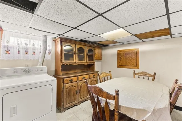 a view of a dining room with furniture and window