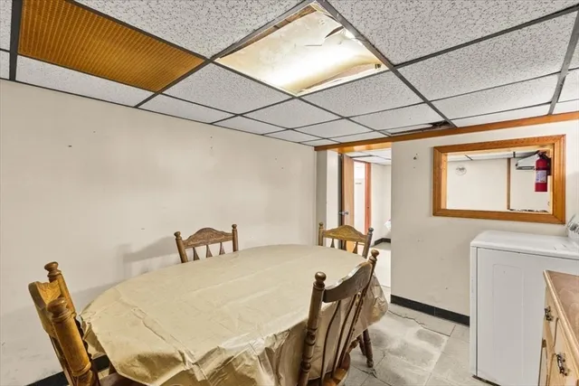 a dining room with furniture and window