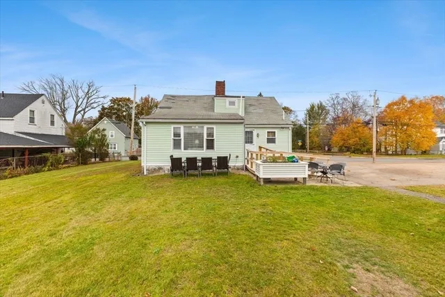 a front view of a house with swimming pool yard and patio