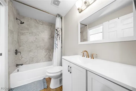 a bathroom with a sink a toilet and a bathtub