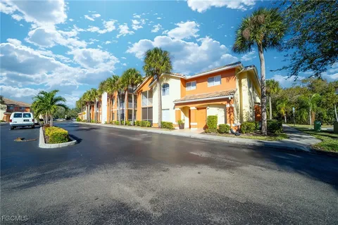 a view of a car park in front of a house