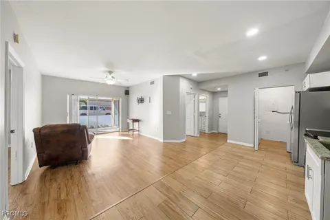 a view of livingroom with furniture and a flat screen tv