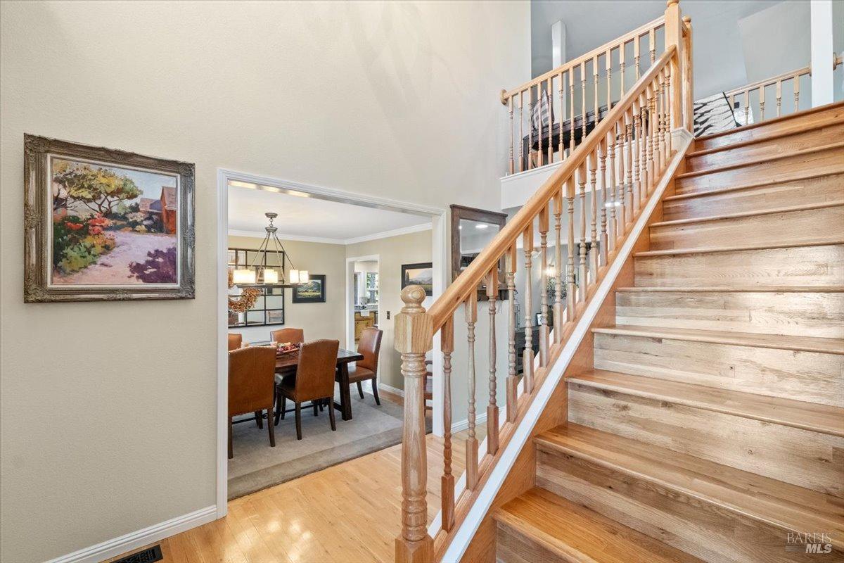 5701 Ridgewood Road Willits, CA 95490 - Photo 34 of 84 a view of staircase with lots of frames on wall and dining room view