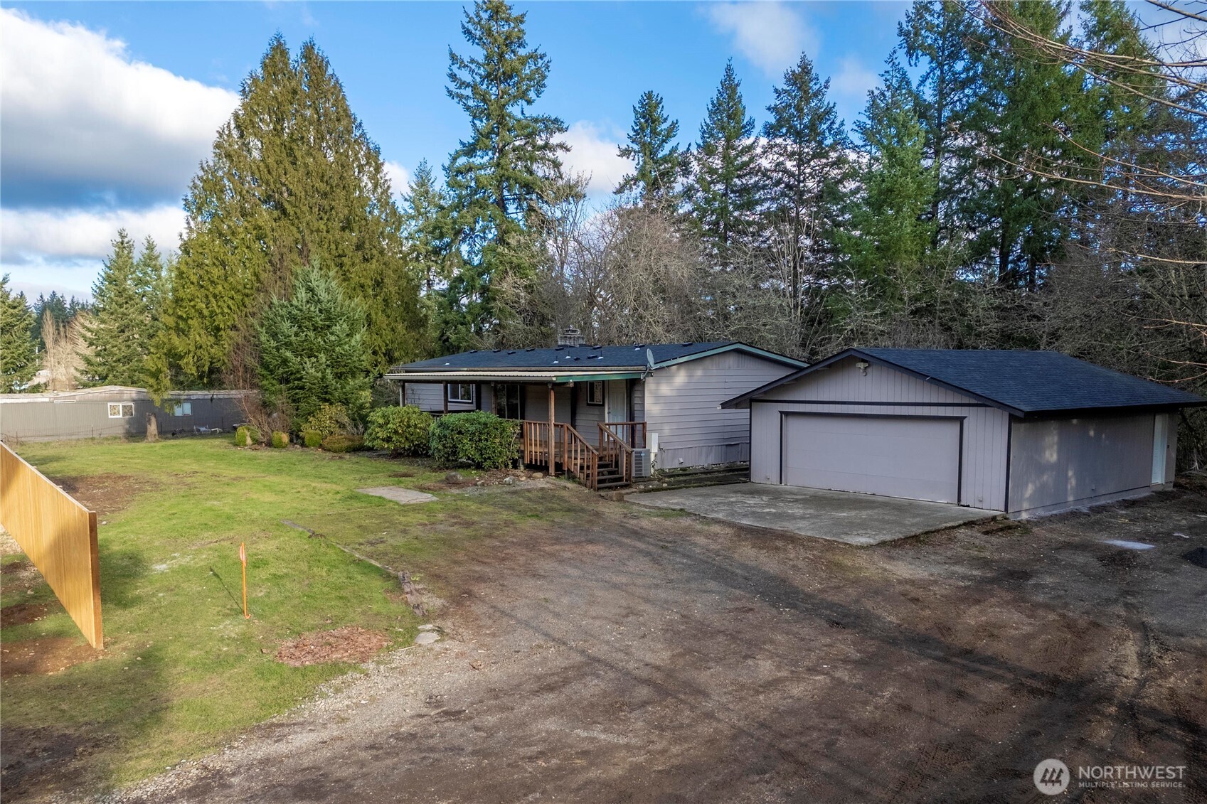 733 Tipsoo Loop South Rainier, WA 98576 - Photo 5 of 37 a front view of a house with a yard and garage