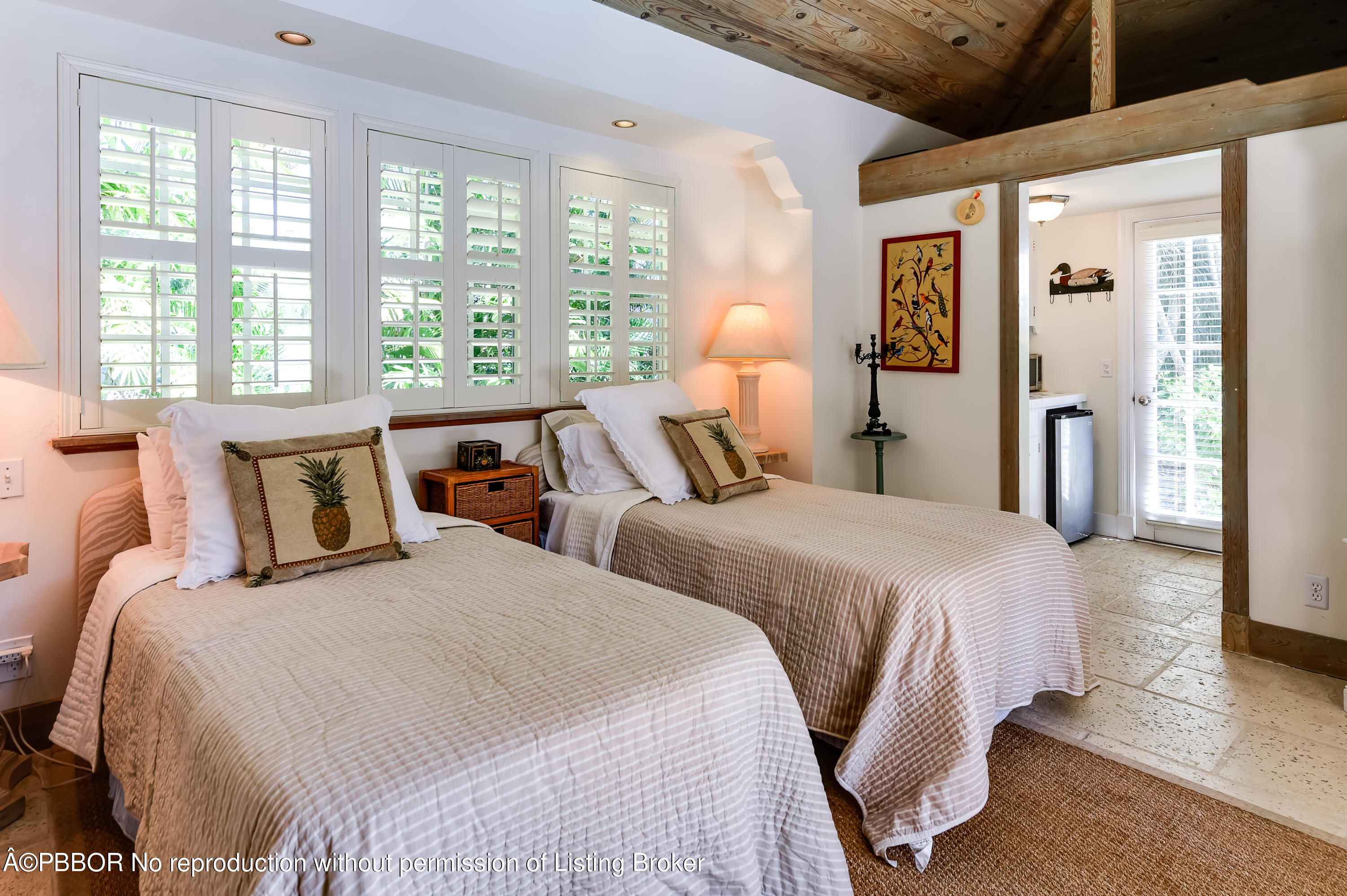 257 Fairview Road Palm Beach, FL 33480 - Photo 12 of 17 a bedroom with two beds and a large window