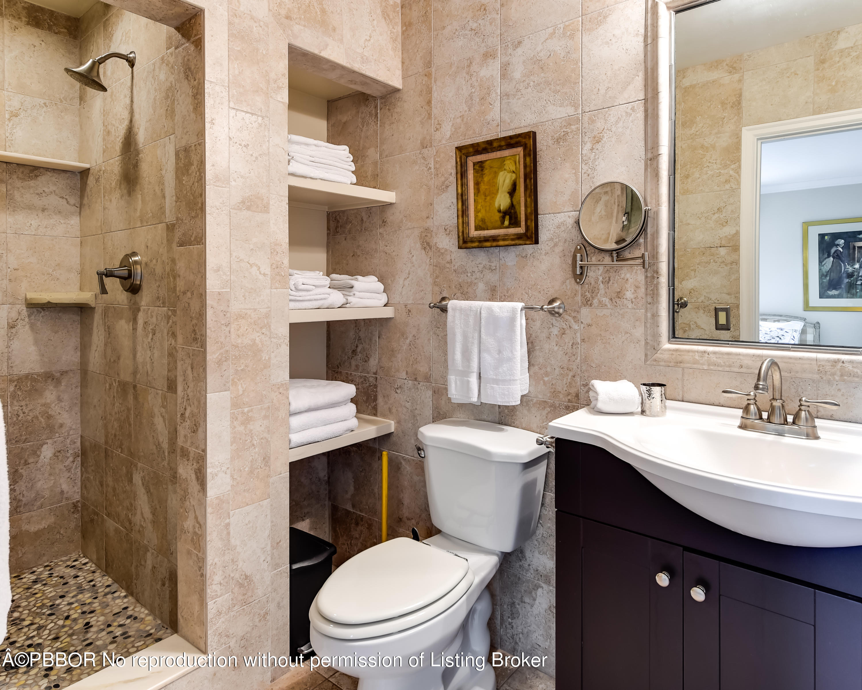 257 Fairview Road Palm Beach, FL 33480 - Photo 14 of 17 a bathroom with a toilet a sink and mirror