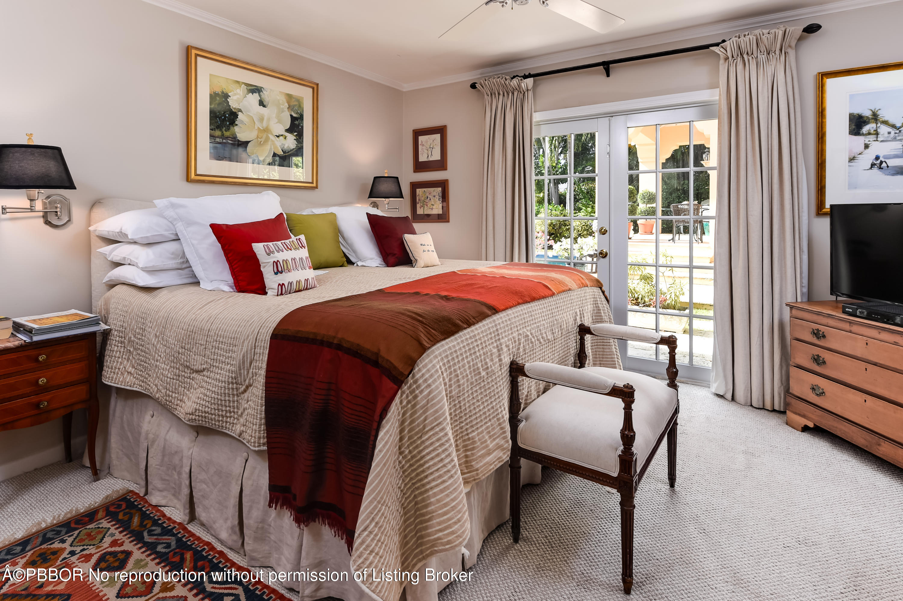 257 Fairview Road Palm Beach, FL 33480 - Photo 8 of 17 a bedroom with a bed and a flat screen tv