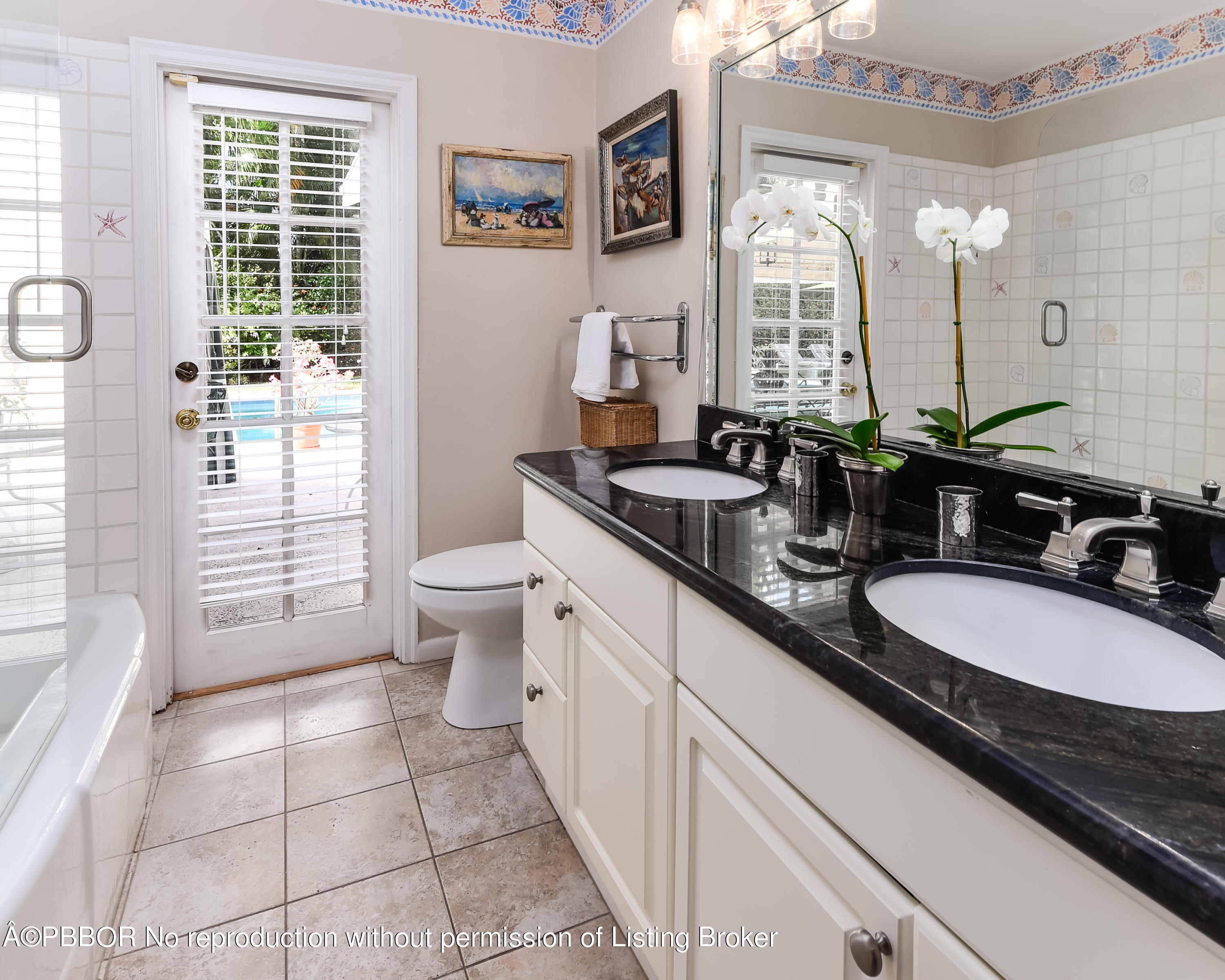 257 Fairview Road Palm Beach, FL 33480 - Photo 10 of 17 a spacious bathroom with a double vanity sink toilet and a mirror