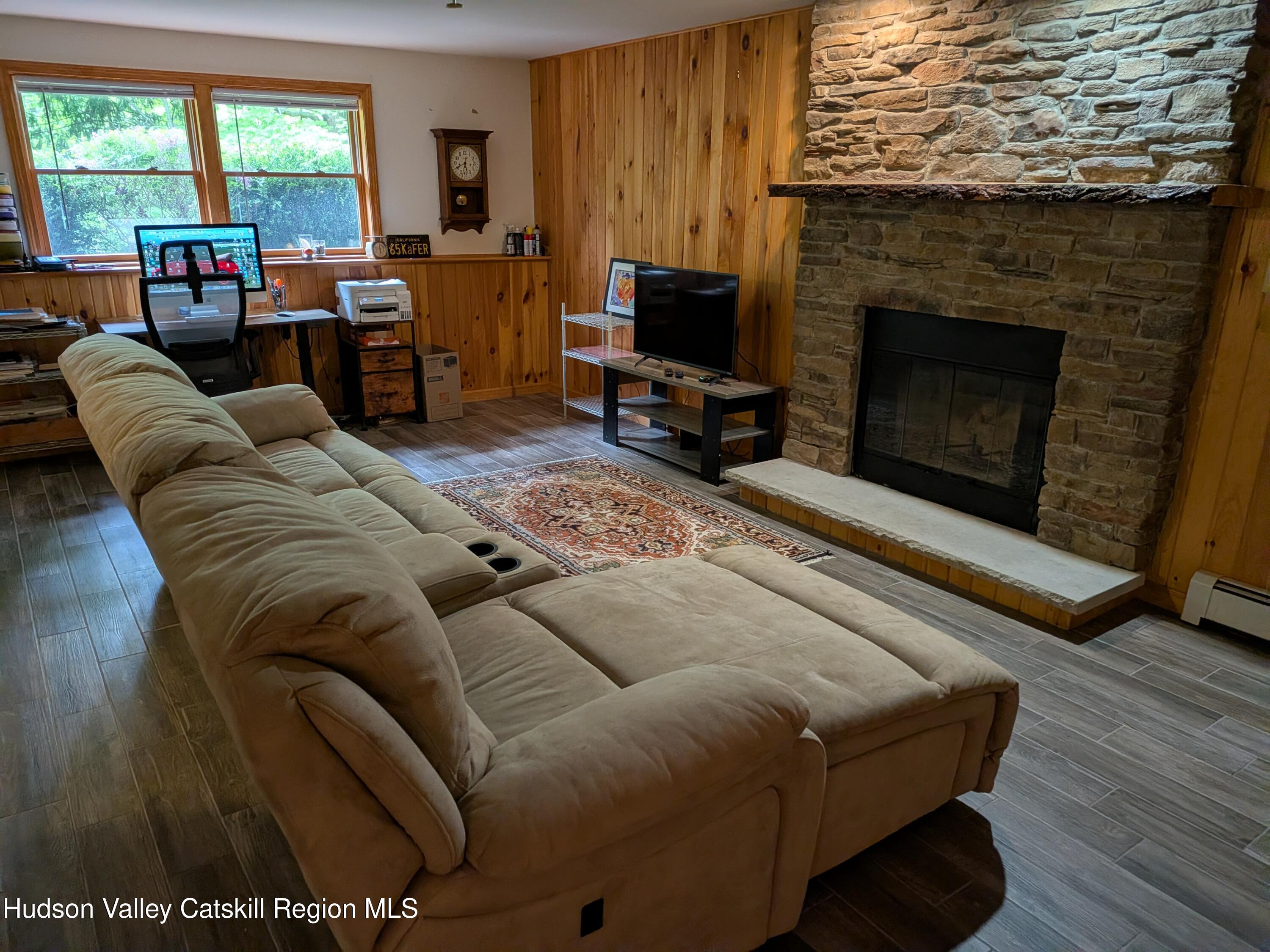 513 South Mountain Road Gardiner, NY 12525 - Photo 30 of 63 a living room with furniture or fireplace and a flat screen tv