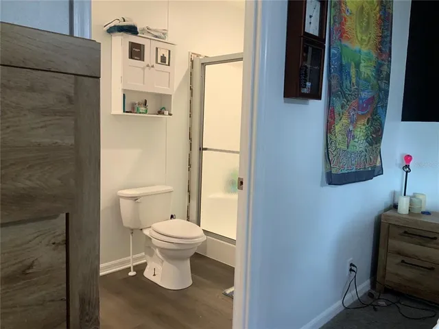 a white toilet sitting next to a bathroom sink