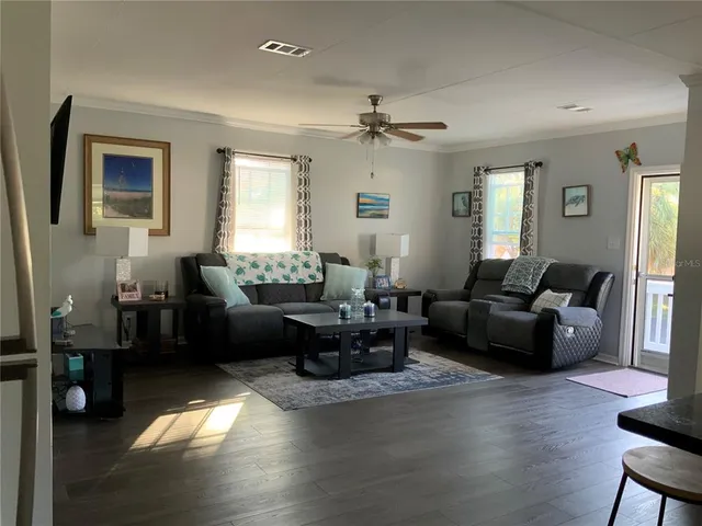a living room with furniture and a window