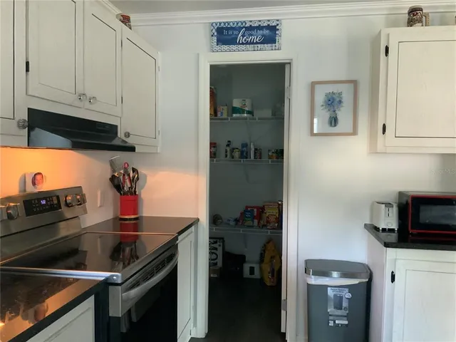 a kitchen with stainless steel appliances granite countertop a stove and a refrigerator