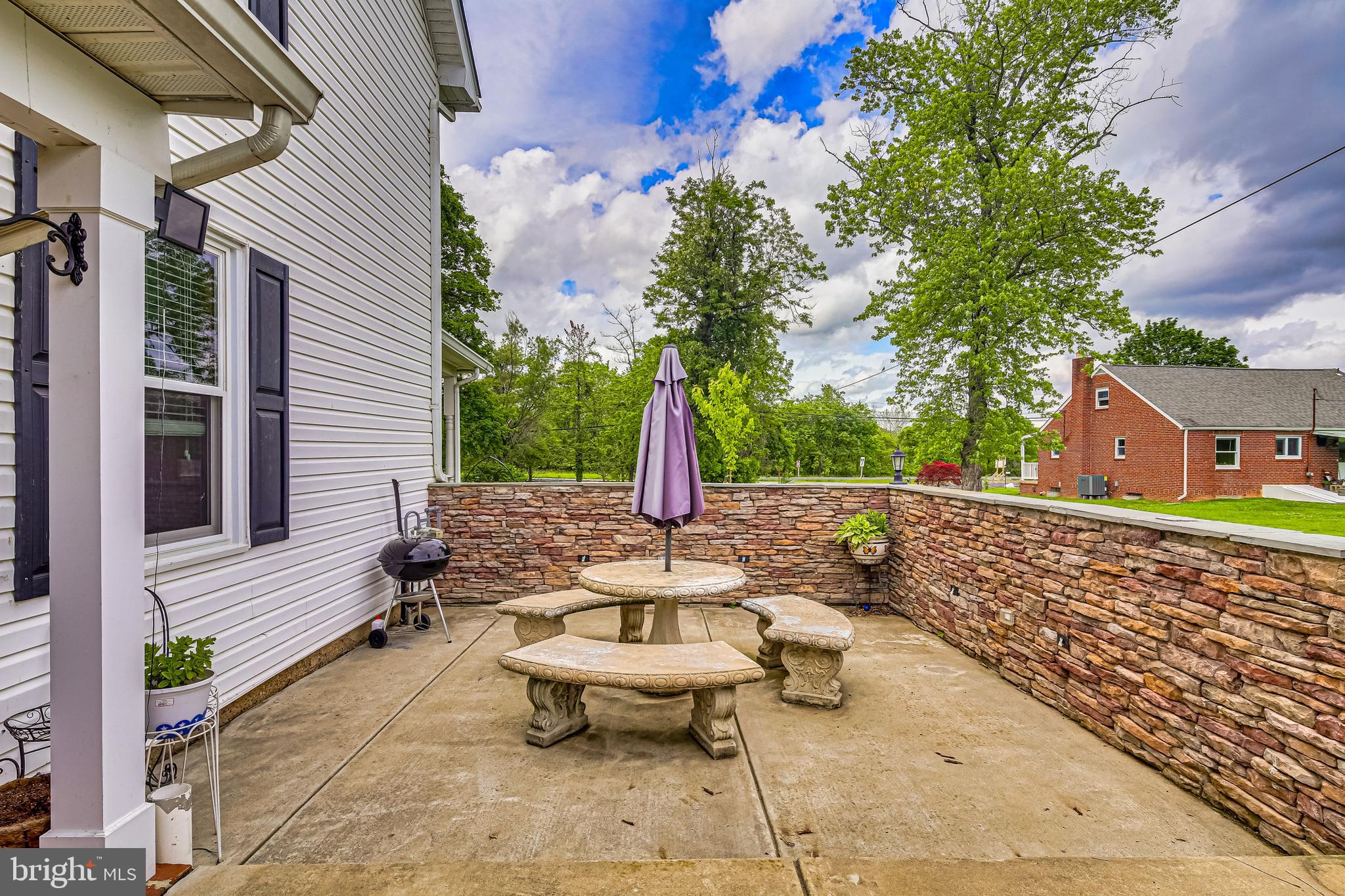 8863 Baltimore Road Frederick, MD 21704 - Photo 24 of 28 Exterior- Patio & Stone Wall