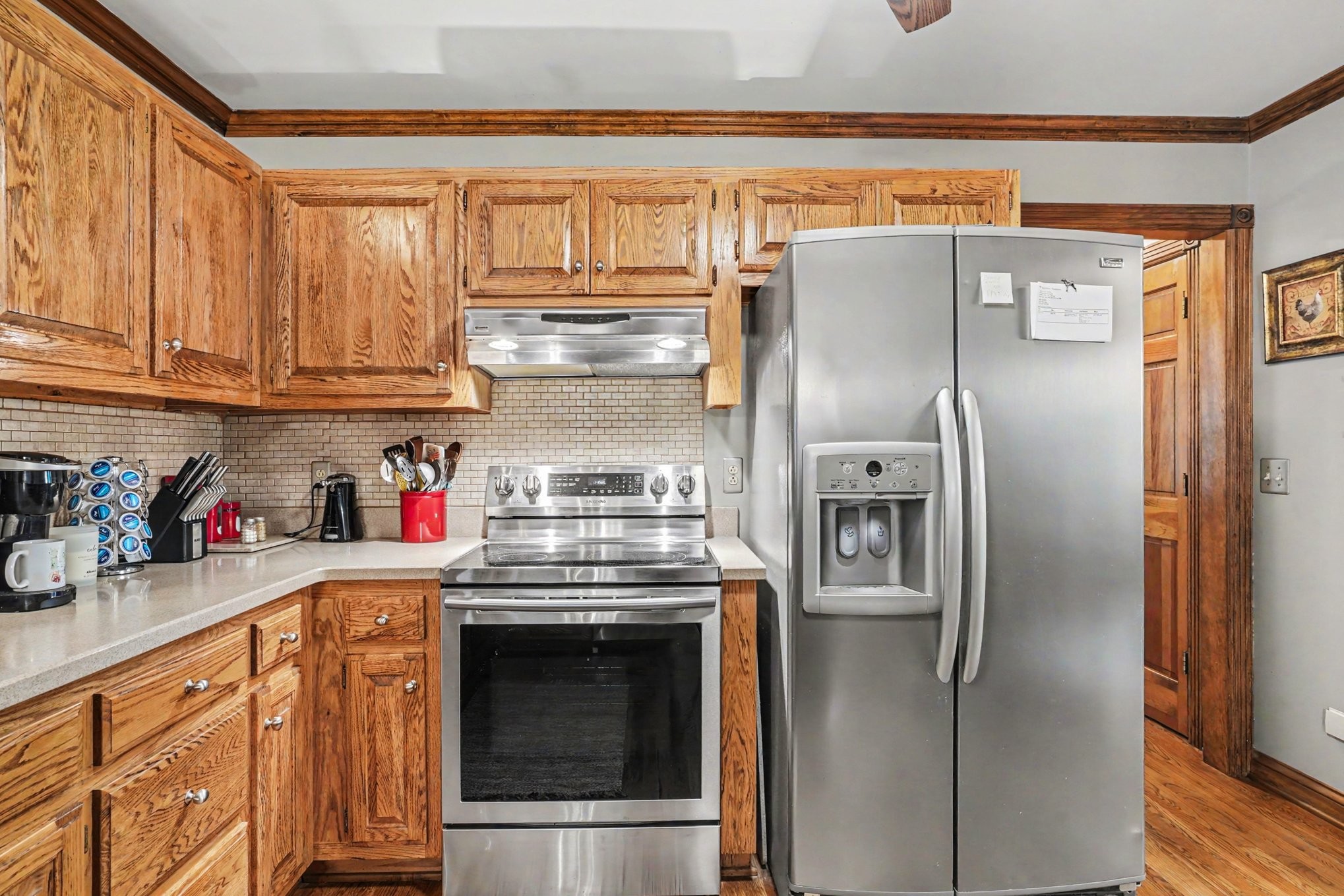 2075 Liebengood Road Goodlettsville, TN 37072 - Photo 12 of 40 a kitchen with stainless steel appliances granite countertop a refrigerator and a stove