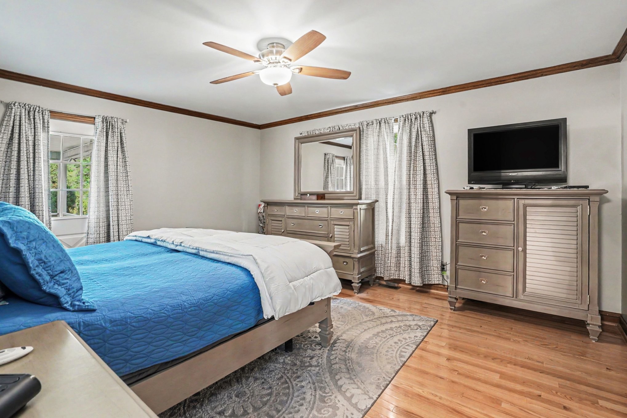 2075 Liebengood Road Goodlettsville, TN 37072 - Photo 14 of 40 a bedroom with a large bed and a flat screen tv