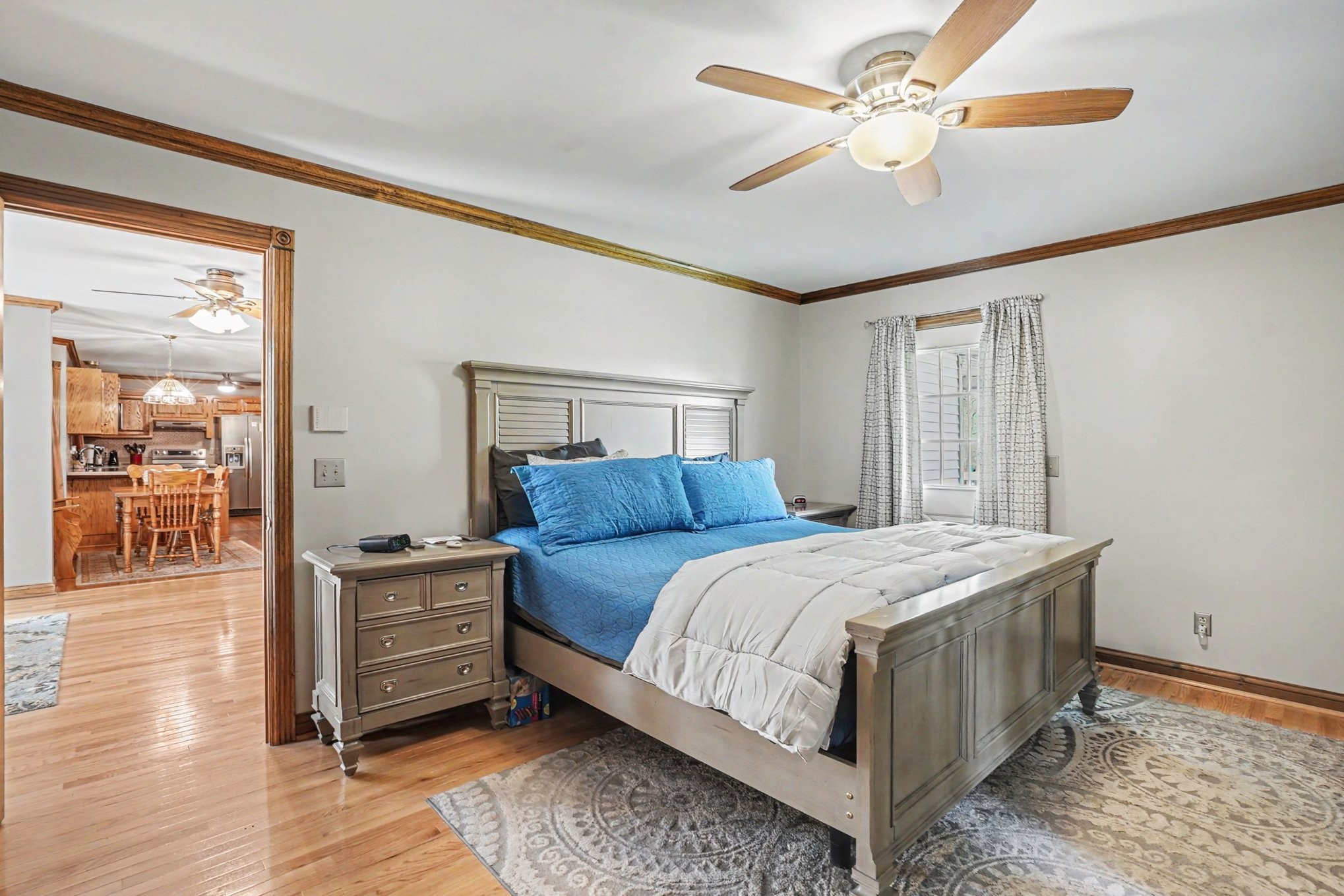 2075 Liebengood Road Goodlettsville, TN 37072 - Photo 16 of 40 a bedroom with a bed and a chandelier
