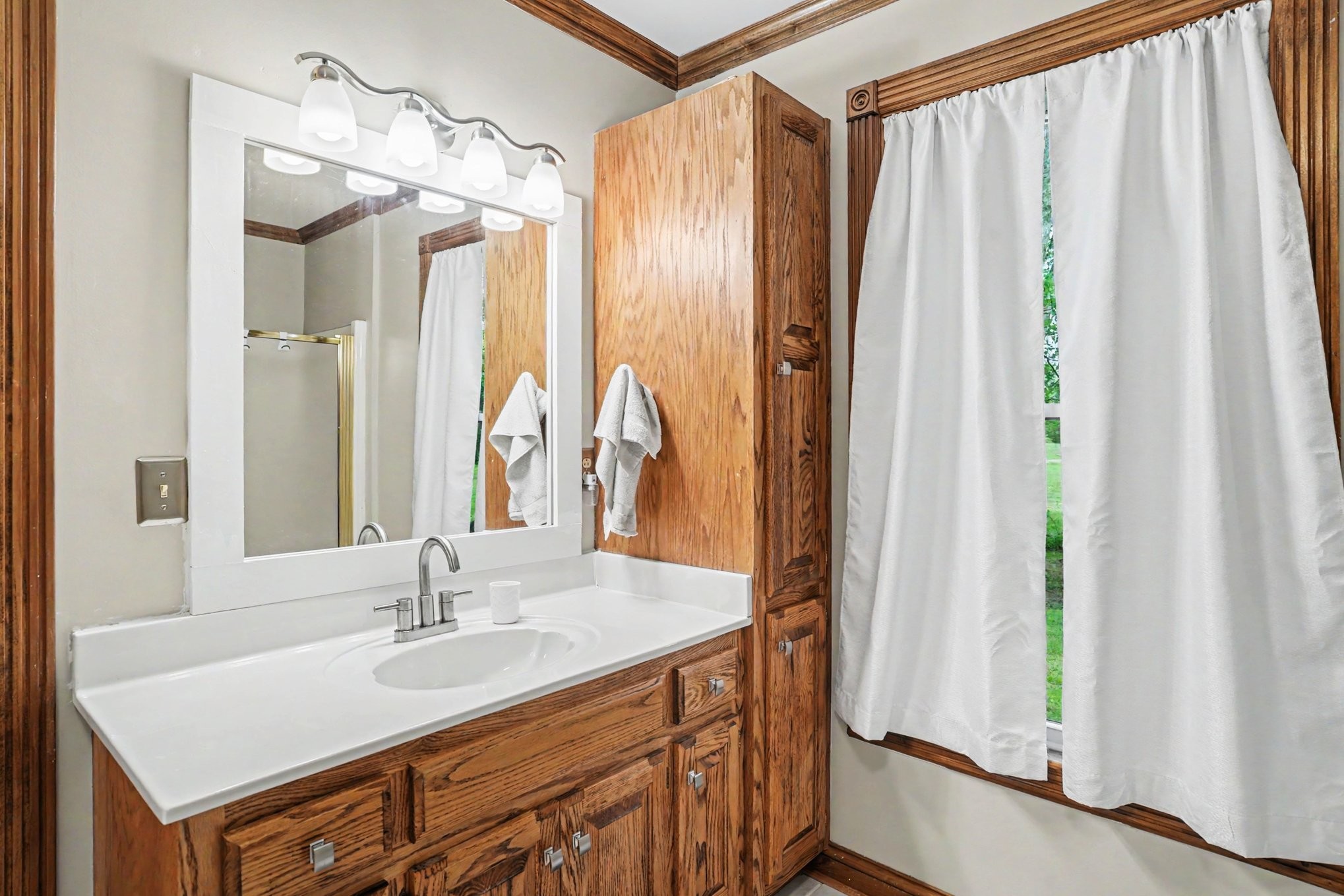 2075 Liebengood Road Goodlettsville, TN 37072 - Photo 18 of 40 a bathroom with a sink a mirror and a shower