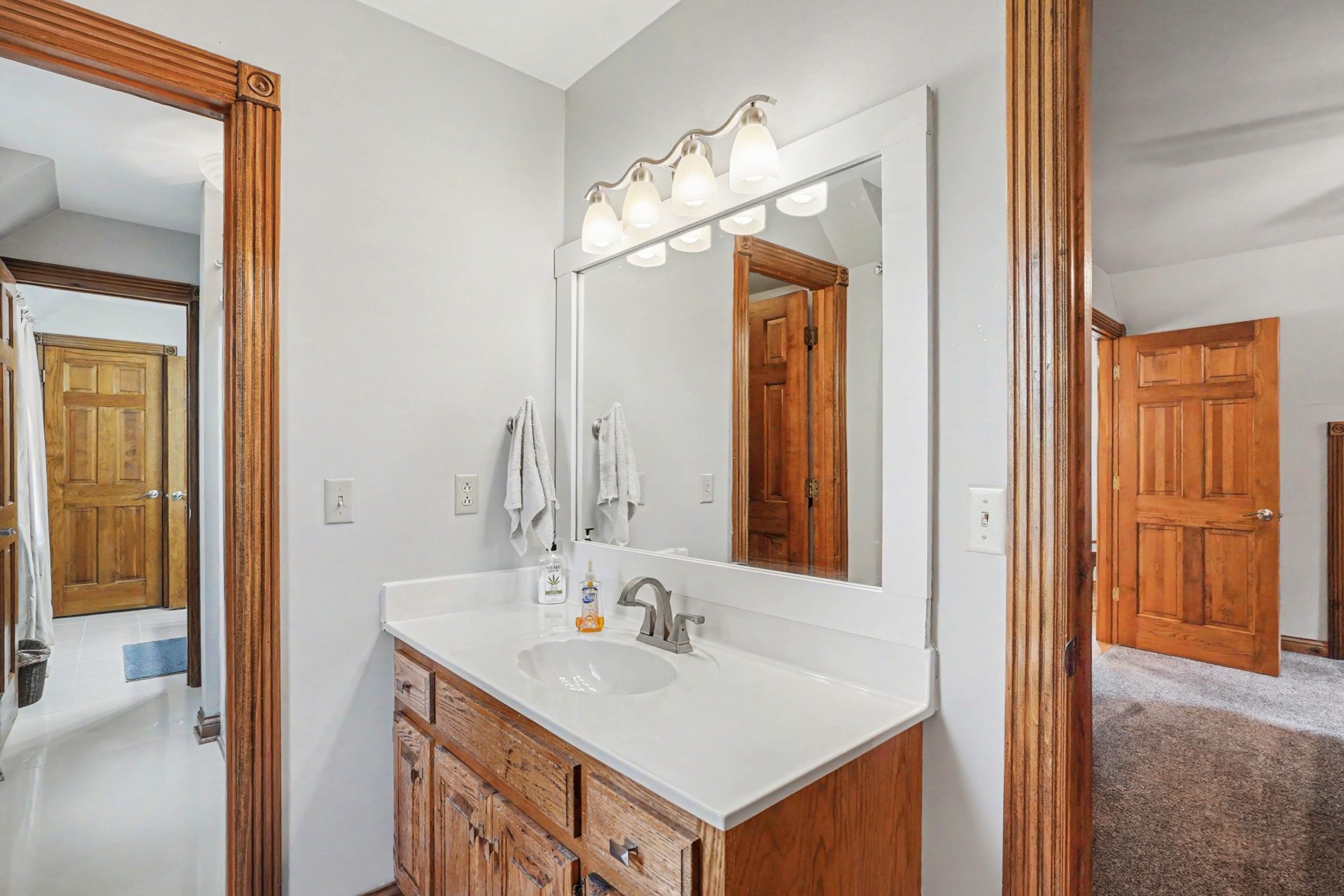 2075 Liebengood Road Goodlettsville, TN 37072 - Photo 25 of 40 a bathroom with a sink and a mirror