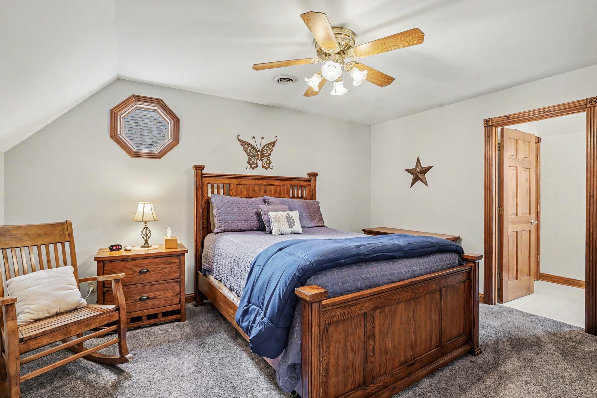 2075 Liebengood Road Goodlettsville, TN 37072 - Photo 26 of 40 a bedroom with a bed and a chandelier
