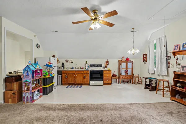 a storage room with furniture and a ceiling fan