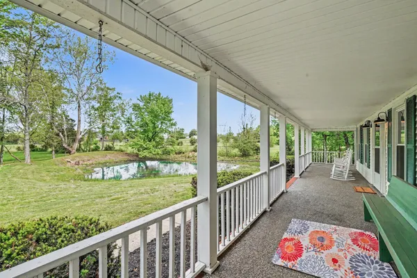 a view of a porch with a yard