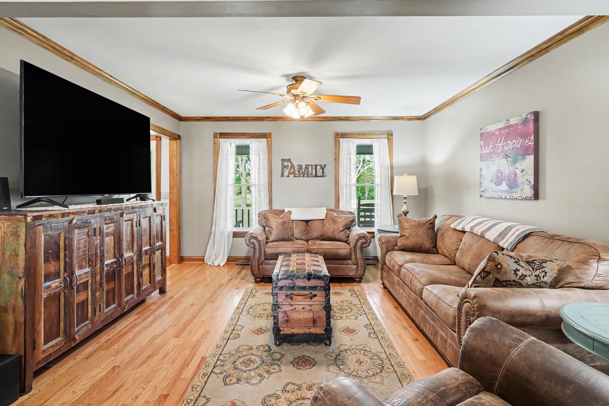 2075 Liebengood Road Goodlettsville, TN 37072 - Photo 7 of 40 a living room with furniture and a flat screen tv