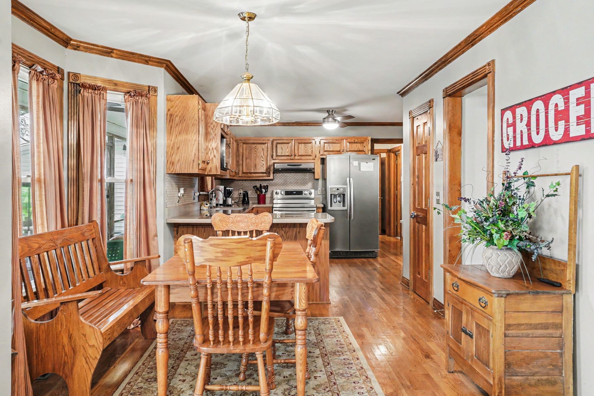 2075 Liebengood Road Goodlettsville, TN 37072 - Photo 10 of 40 a dining room with furniture a chandelier and wooden floor