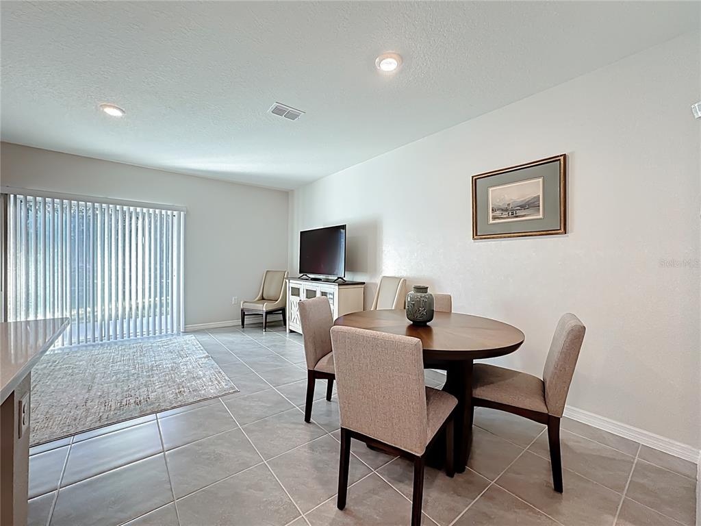 3140 Goose Road Davenport, FL 33837 - Photo 11 of 40 a view of a livingroom with furniture and a flat screen tv