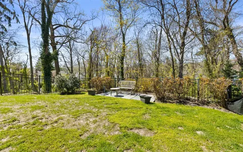 a view of a swimming pool with an outdoor space and seating area