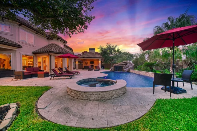 a view of a swimming pool with a porch