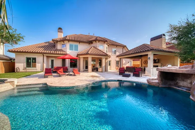 a view of a house with a yard porch and sitting area