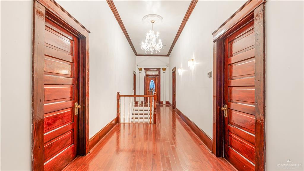 600 East Mirasoles Street Rio Grande City, TX 78582 - Photo 16 of 26 wooden floor in an empty room with a window
