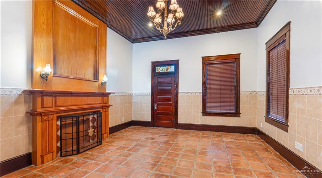 600 East Mirasoles Street Rio Grande City, TX 78582 - Photo 4 of 26 a view of an empty room with a fireplace and a window