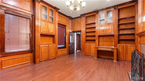 a view of a livingroom with furniture and hardwood floor