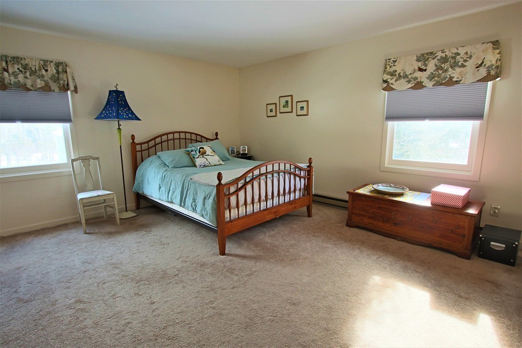 46 Evergreen Road, Unit 209 Northampton, MA 01053 - Photo 8 of 12 a room with a bed and a desk