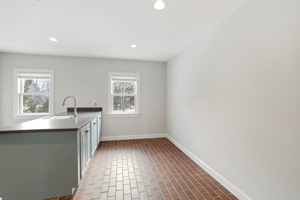 74 Branch Street, Unit 15 Scituate, MA 02066 - Photo 14 of 26 a view of workspace with wooden floor and window