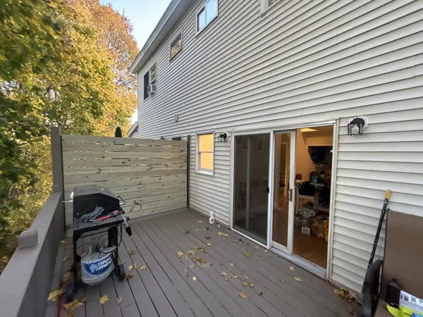 a view of a porch with wooden floor and stairs