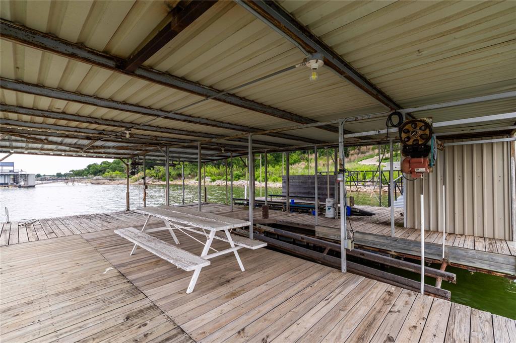 977 Deep Water Road May, TX 76857 - Photo 18 of 36 a view of outdoor space with wooden floor and outdoor seating