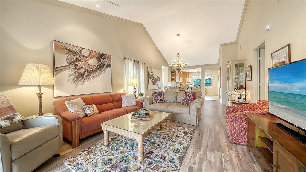 6204 Midnight Pass Road, Unit 205 Sarasota, FL 34242 - Photo 11 of 62 a living room with furniture and a rug