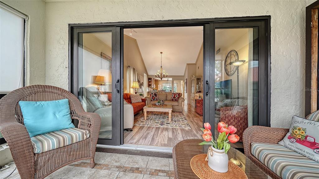 6204 Midnight Pass Road, Unit 205 Sarasota, FL 34242 - Photo 14 of 62 a living room with furniture and a large window