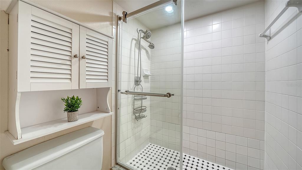 6204 Midnight Pass Road, Unit 205 Sarasota, FL 34242 - Photo 26 of 62 a bathroom with a shower
